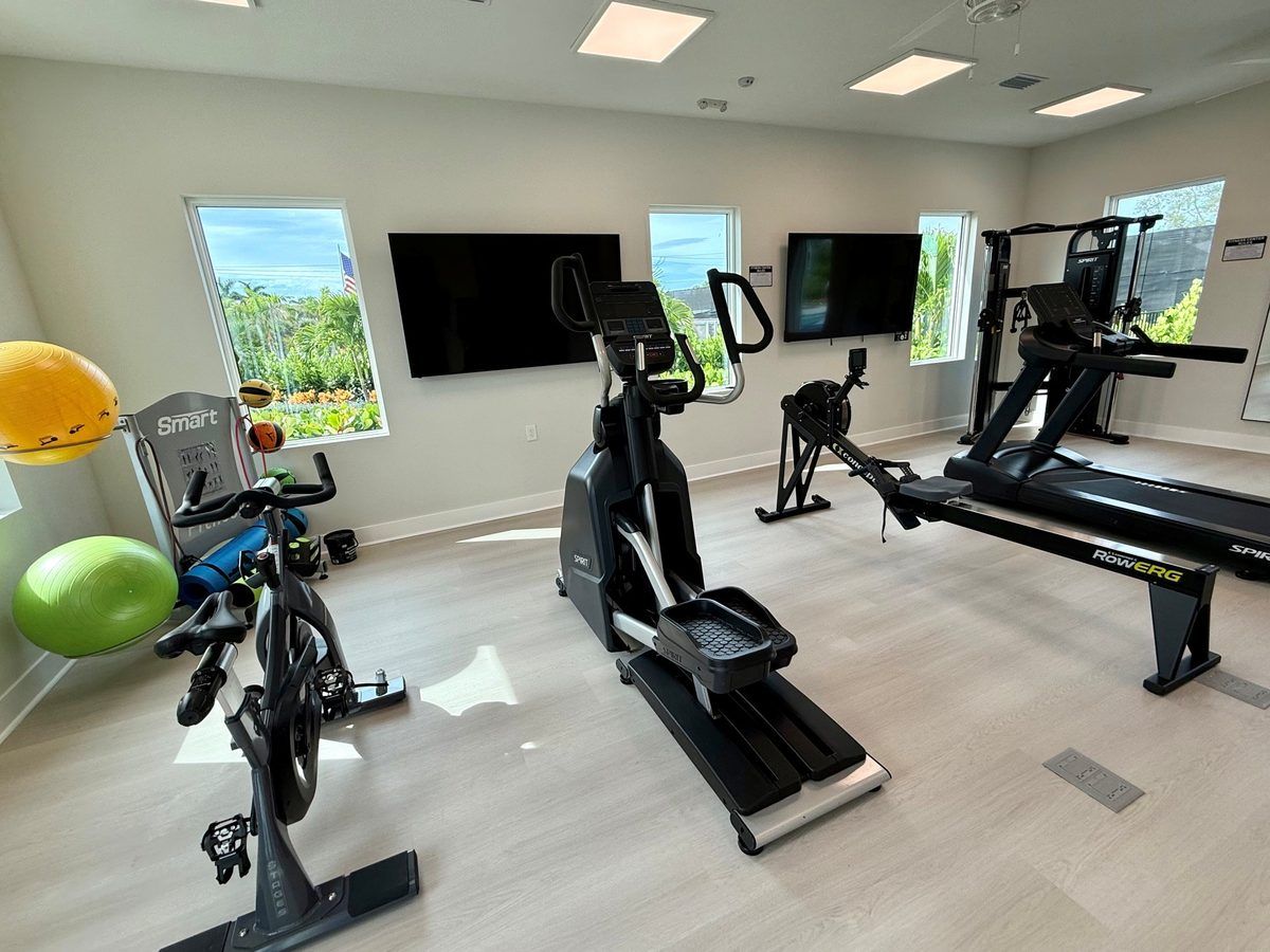 fitness center with wights and cardio equipment